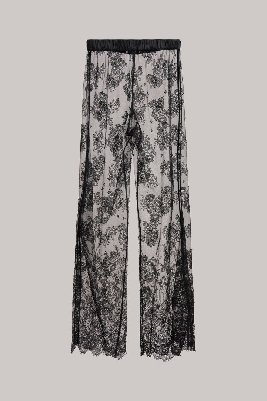 Black floral lace wide-leg pants with an elastic waistband, shown flat against a solid light gray background.