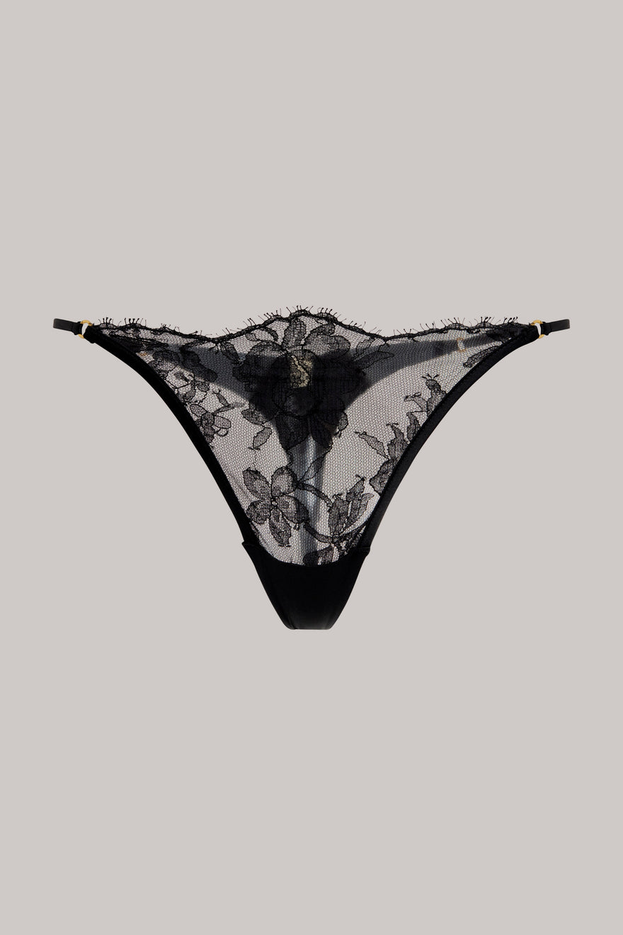 Black lace thong underwear with floral lace patterns and a solid black waistband, displayed flat against a solid light gray background.