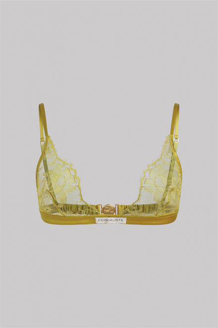 A yellow lace bralette with a gold trim and a small white brand label that reads 'EVANGELISTA' on a solid gray background.