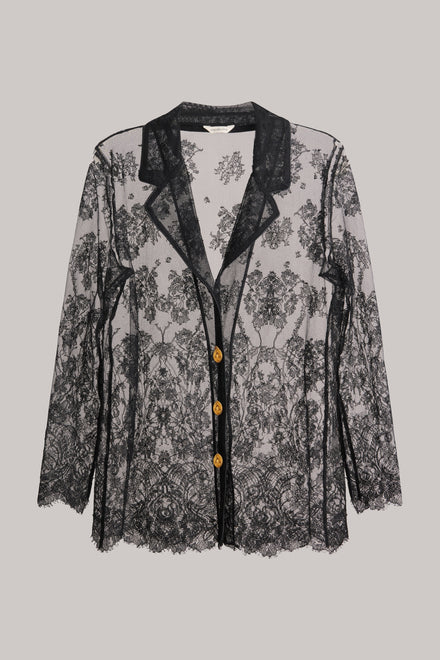 Black lace cardigan with gold buttons on a gray background
