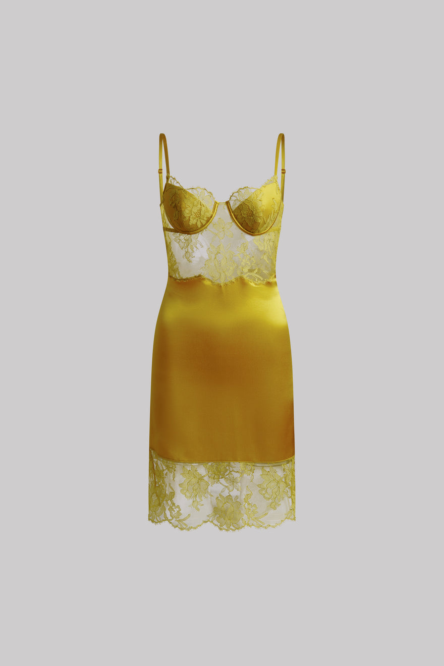 A yellow satin chemise nightgown with white lace cups, waistband, and hem, displayed against a solid gray background.