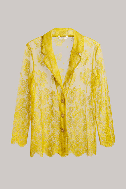 A yellow floral lace long-sleeve button-up shirt jacket with a notched collar, displayed against a solid gray background.