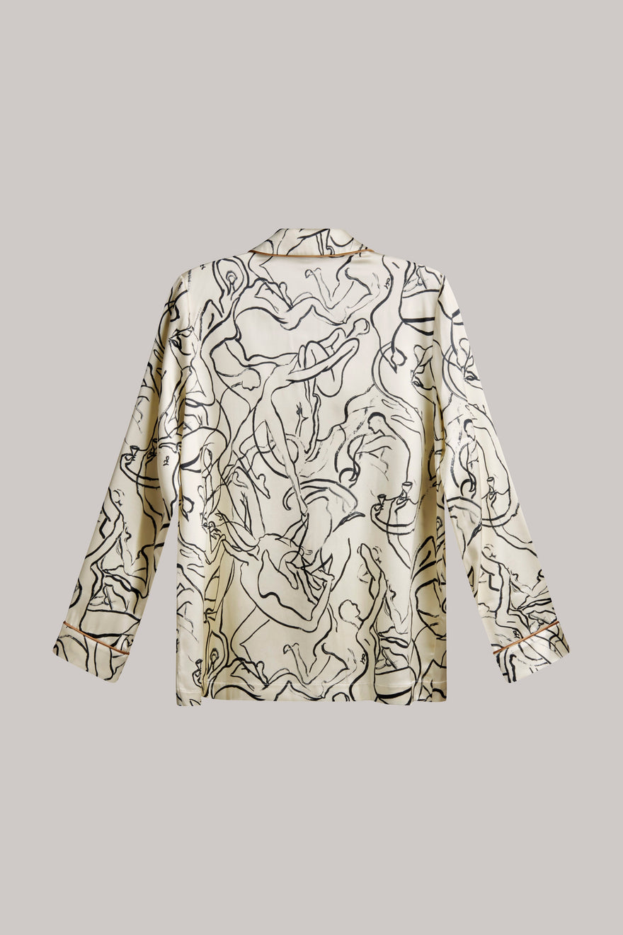 A long-sleeve collared shirt with an abstract black line art print on a warm cream background, displayed flat against a solid gray background.