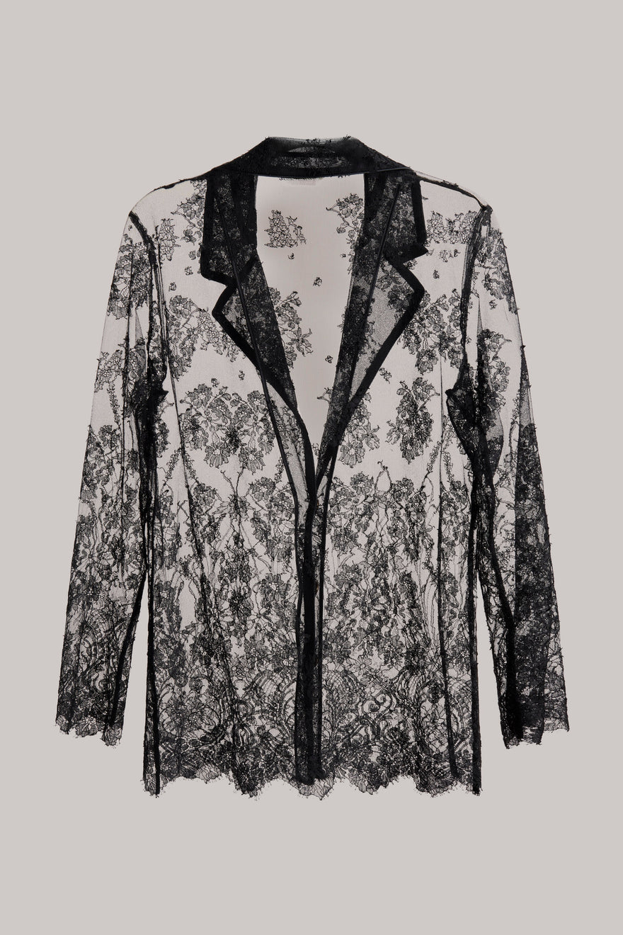 Black lace jacket on a light gray background